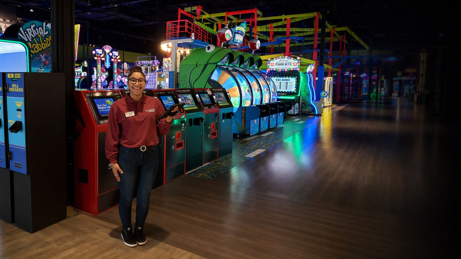 A family entertainment center floor with VEETOP machines and staff support on site